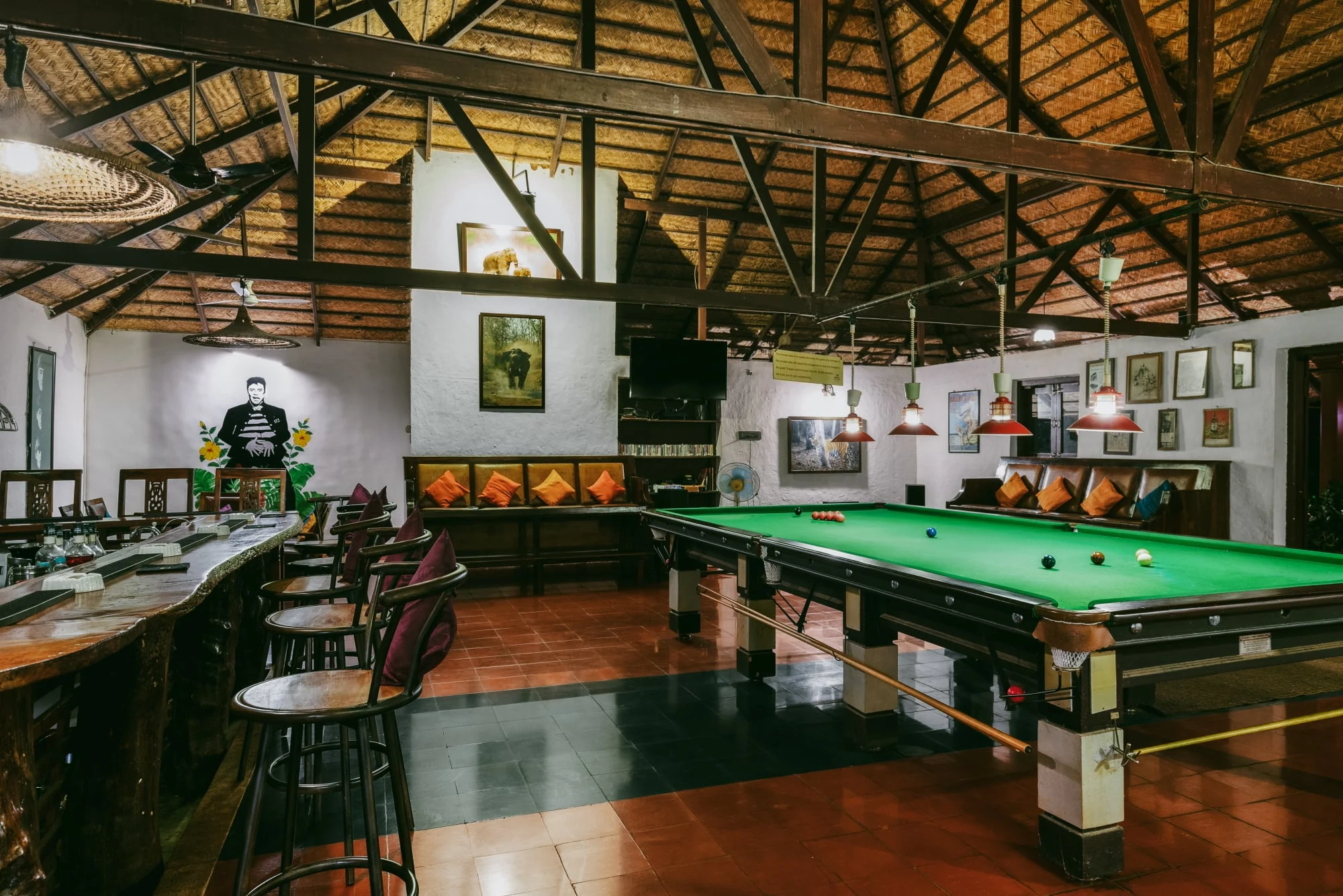 Timber rafters, seating, and a billiards table inside the Wetlands Bar