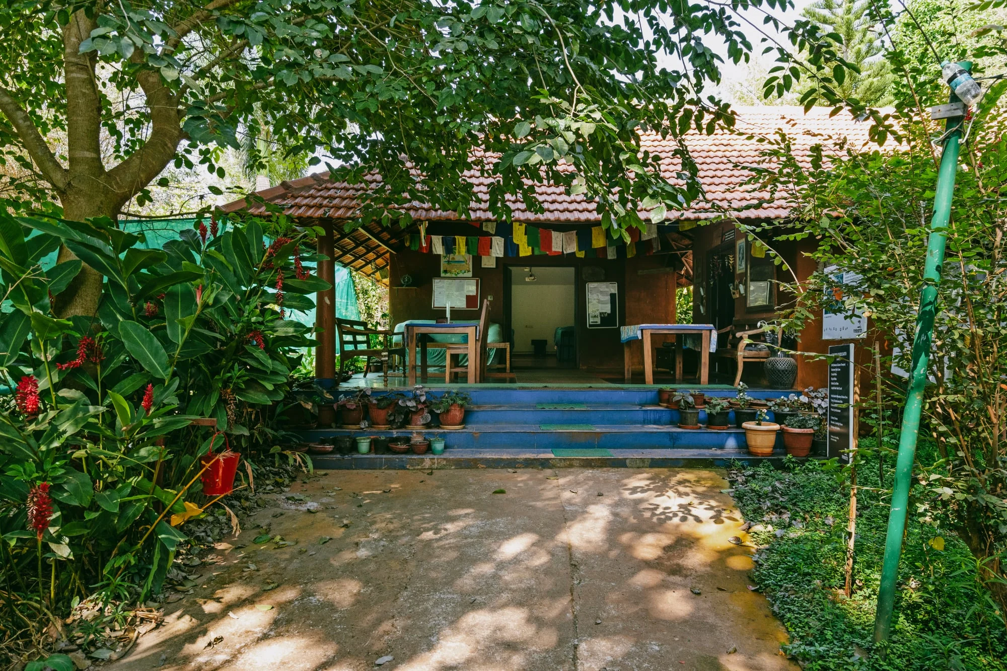 A garden pavilion reached by a shaded path
