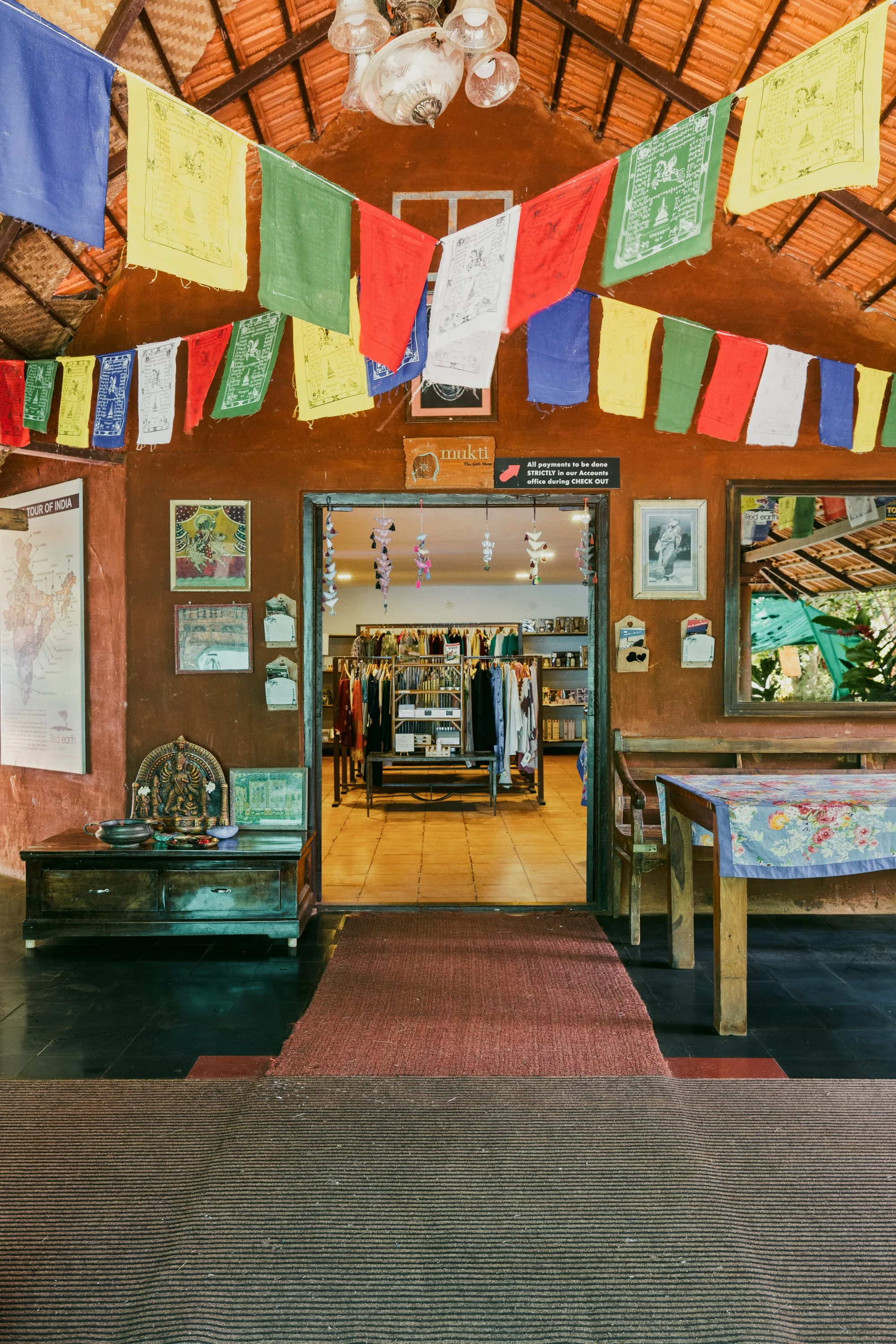 The retreat shop decorated with forest photographs and prayer flags
