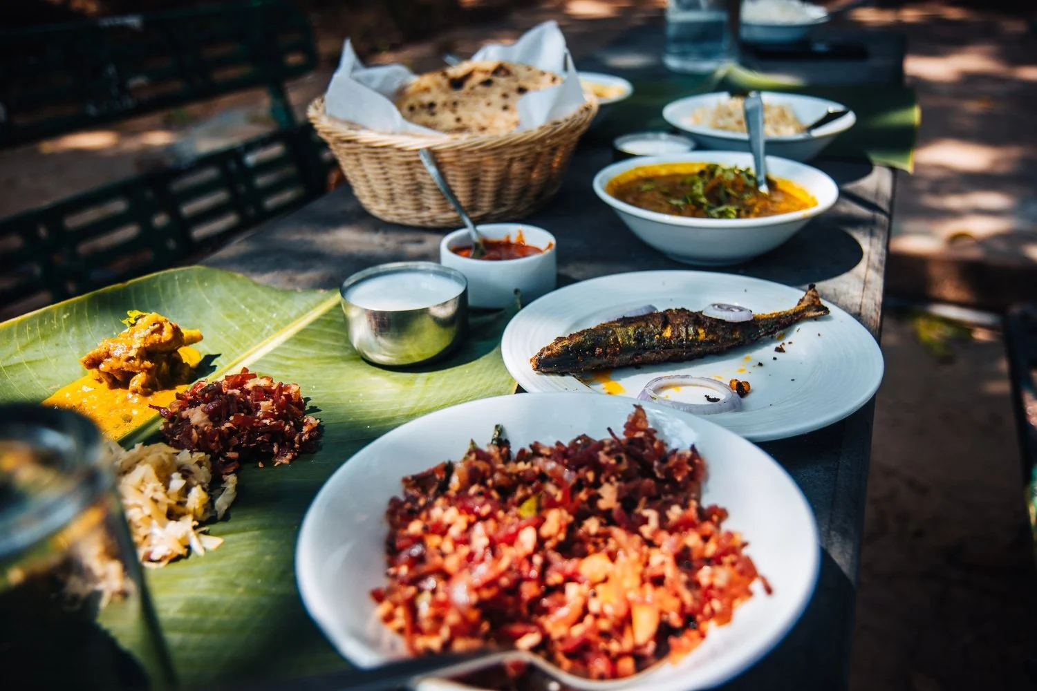 A banana-leaf meal with fried fish, spiced dishes and flatbreads