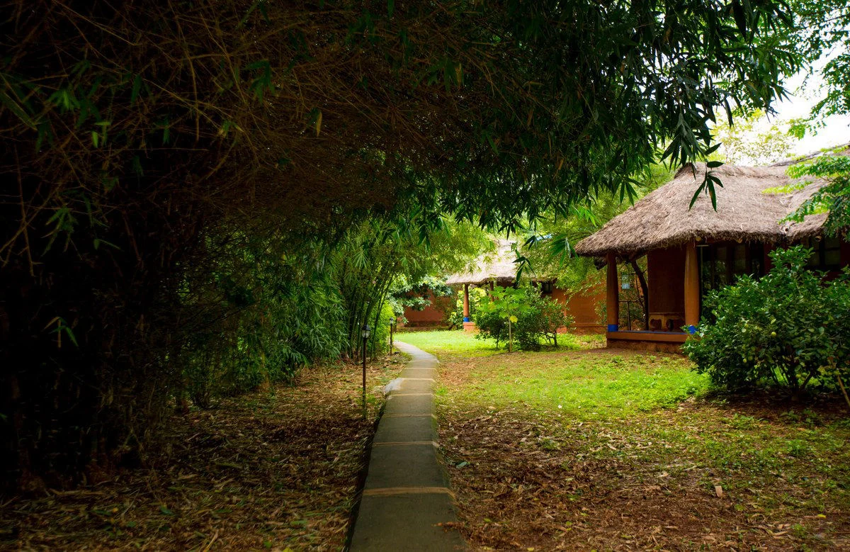 Earth-toned cottages at Red Earth Kabini