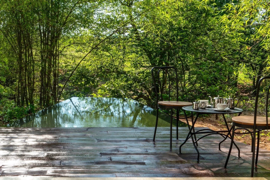 A quiet pool surrounded by nature at Red Earth