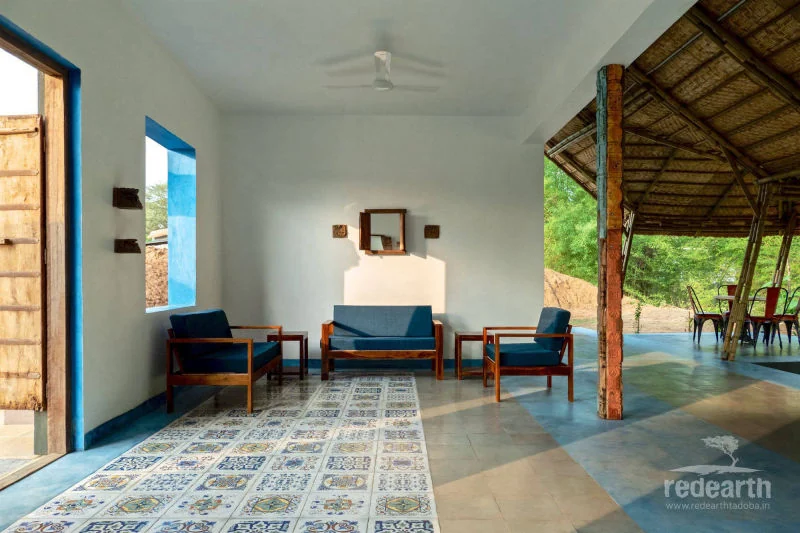 A cool, high-ceilinged Tadoba cottage sitting area