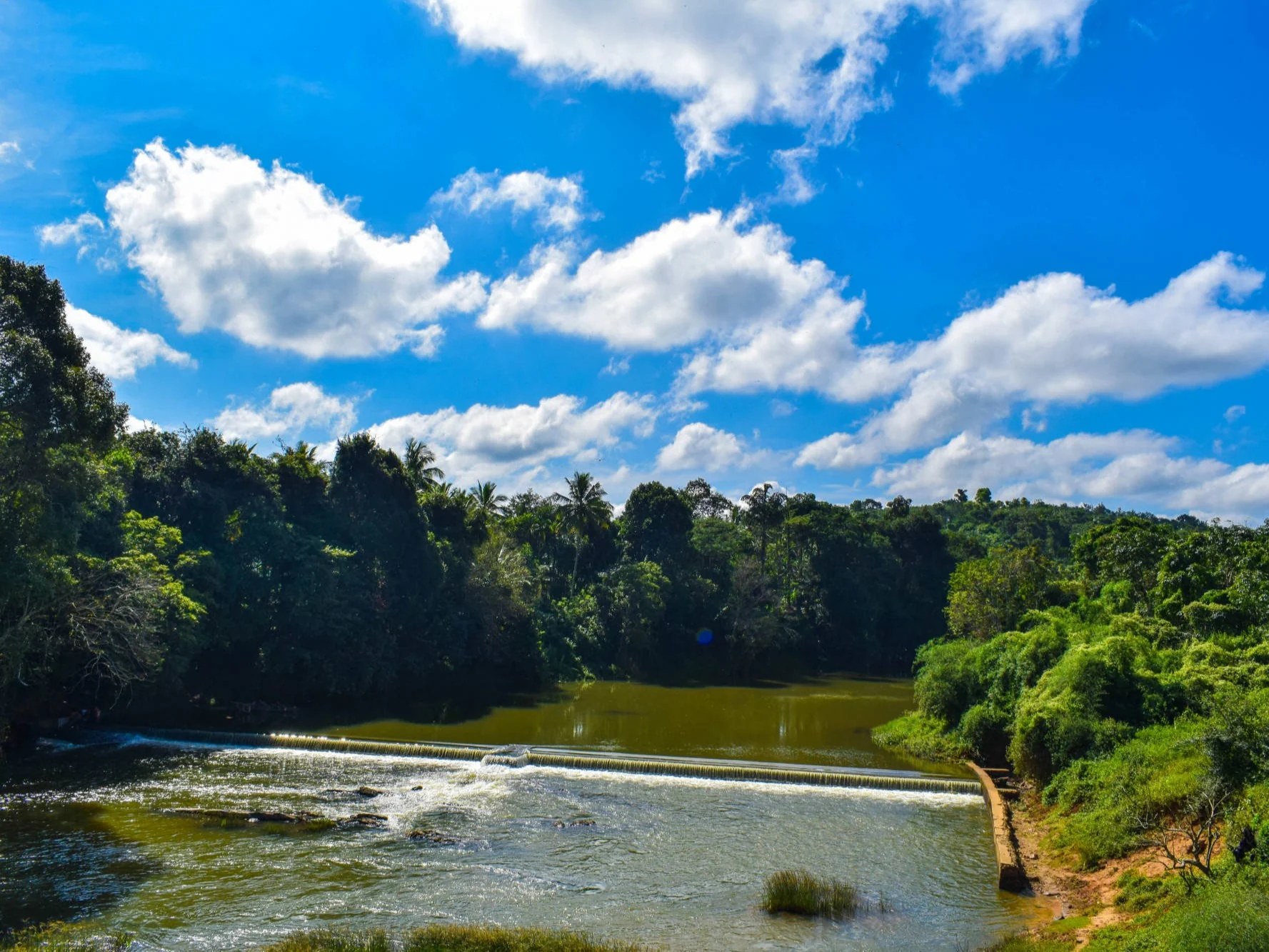 A river bend surrounded by wooded hills